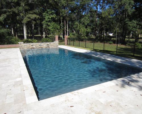 Moultrie custom pool design featuring modern layout and stone deck.