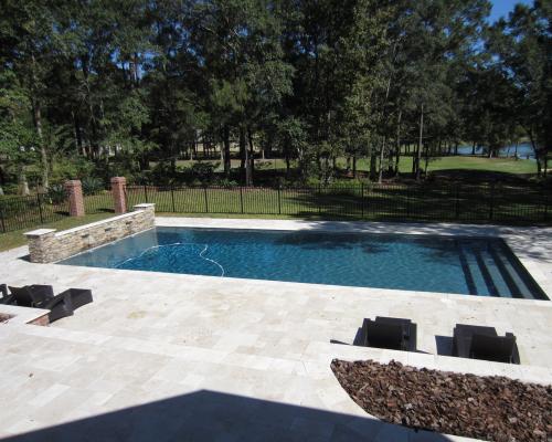 Tifton custom pool design with clean curves and elegant stone finishes.