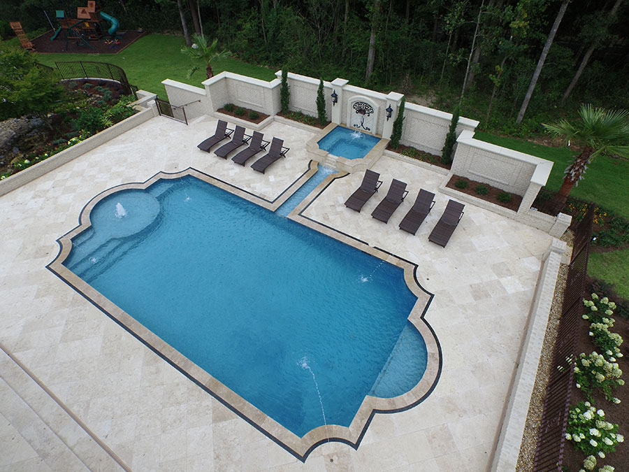 Residential swimming pool contractor showcasing custom pool installation.