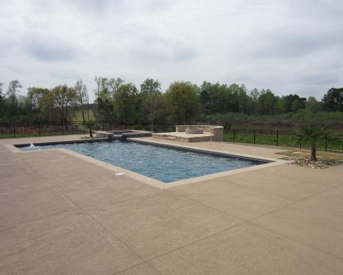 Saint George Island swimming pool construction with coastal design and blue water.