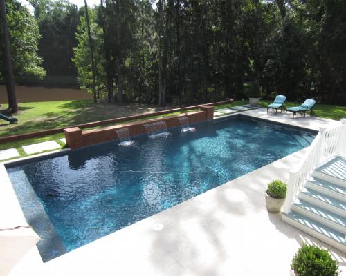 Tifton swimming pool construction with durable materials and elegant layout.