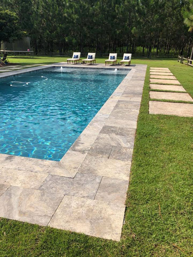 Thomasville saltwater pool with elegant design and natural stone surfaces.